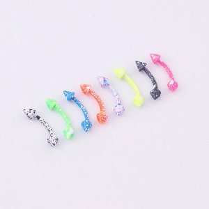 Eight colorful paint-splattered stainless steel eyebrow rings with cone spikes in a row