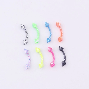 Macro view of eight colorful curved barbell eyebrow rings with speckled cone spikes