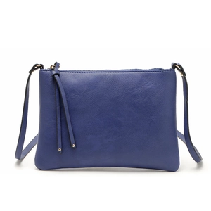 Close-up of blue PU leather envelope crossbody bag with decorative tassel and gold zipper