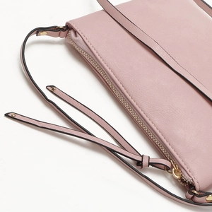 Detailed close-up of light pink PU leather envelope bag with gold zipper and shoulder strap