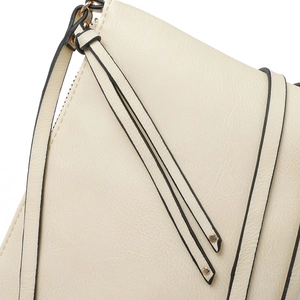 Detail of beige leather envelope bag showing metal zipper and shoulder strap hooks
