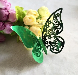 Detailed view of a green 3D hollow butterfly wall sticker with metallic reflective finish