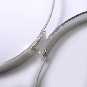 Macro view of S925 sterling silver stamp and polished finish on geometric earrings
