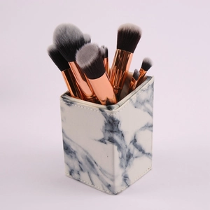 Marmor Make-up Pinselhalter Set mit Roségold Zwingen für elegante Kosmetik Aufbewahrung.