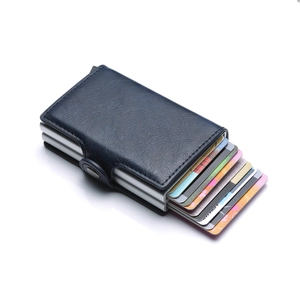 Dark blue PU leather dual card wallet with aluminum pop-up mechanism and cards inside