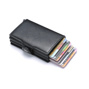 Detail view of black PU leather card holder with automatic pop-up aluminum mechanism