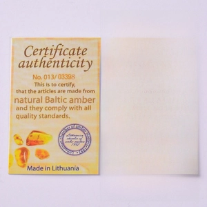 Detail of Baltic amber authenticity certificate and infant safety instructions card