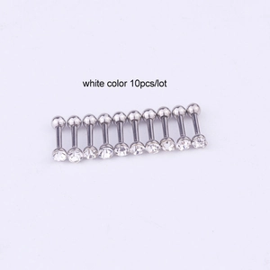 Macro view of 10-piece lot stainless steel barbell studs with clear zircon stones