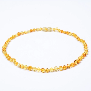 Detailed view of polished natural Baltic amber beads with a secure screw clasp