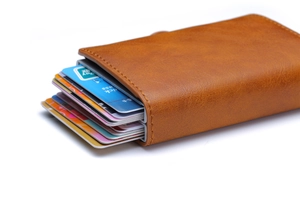 Detailed view of brown leather automatic pop-up wallet with multiple cards inside