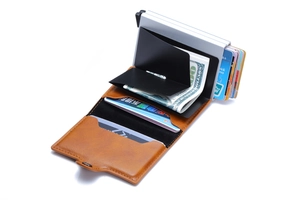 Close-up of brown PU leather wallet with dual aluminum pop-up card holders and cash slot