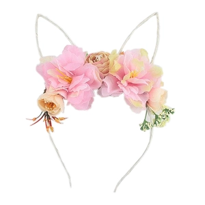 Pink and champagne artificial floral cat ear headband with green leaves on white background