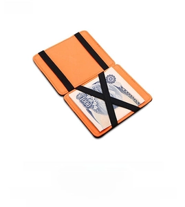 Internal view of magic wallet with orange leather finish and black elastic cross straps