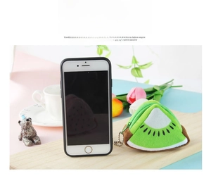Detail of plush kiwi fruit coin purse with zipper, shown next to phone for scale