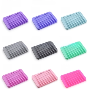 Nine colorful silicone soap holders with wave drainage design shown in a grid layout