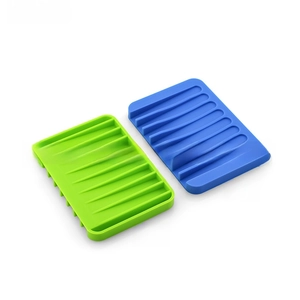 Detail of rectangular silicone soap holders with non-slip ridges for drainage