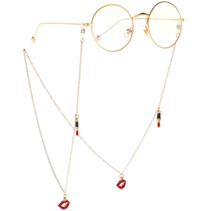 Golden eyewear chain with red lips and lipstick charms for a stylish non-slip look