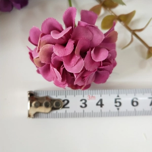 Magenta artificial hydrangea head measuring 4.5cm in diameter with a ruler