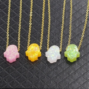 Hamsa Hand opal necklaces in pink yellow white and green colors with gold chain links