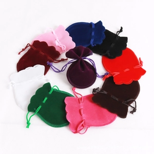 Macro view of multi-color drawstring velvet jewelry pouches in high-quality fabric