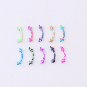 Macro detail of 10 colorful marbled stainless steel curved eyebrow rings on white background