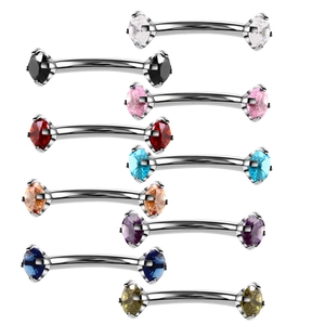 Close-up of ten curved eyebrow rings with colorful cubic zirconia in polished steel