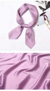 Detail of elegant lilac silk scarf with premium glossy texture and soft knot styling