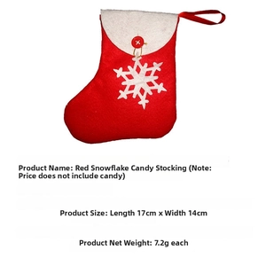Detail of red felt Christmas stocking with white snowflake and button for holiday decoration