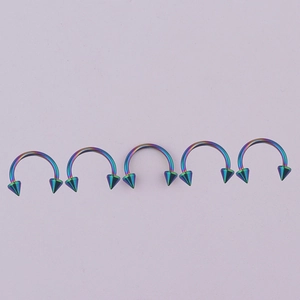 Set of five rainbow 316L stainless steel horseshoe rings with conical spikes for piercing