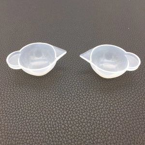 Top view of two silicone mixing cups with pouring spout for DIY resin art casting