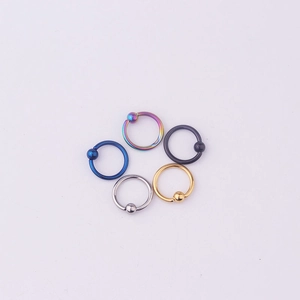 Macro shot of 5 colors 316L stainless steel captive bead rings for body piercing jewelry