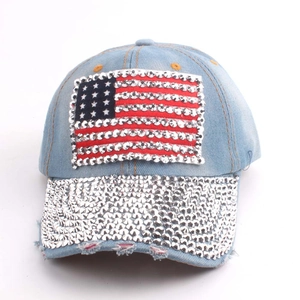 Blue denim baseball cap with rhinestone American flag design and sparkling brim