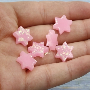 Detailed macro view of pink Star of David synthetic opal gems for DIY jewelry making