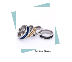 Set of four rotating stainless steel spinner rings in blue gold silver and black