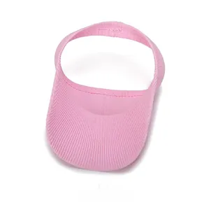 Top-down view of pink knit sun visor showing detailed ribbed texture and wide curved brim