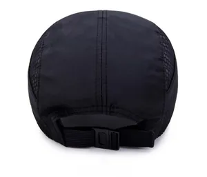 Detail of black quick-dry sports cap showing breathable mesh side and adjustable buckle