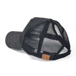 Detail of glitter baseball cap with mesh back and pony tail hole featuring C.C leather patch
