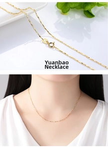 Close-up of S925 hallmark on 14K gold plated ingot chain necklace worn by a model