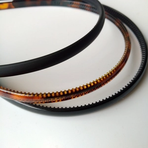 Detail shot of plastic headbands featuring matte black finish and non-slip inner teeth