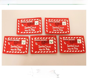 Detailed view of red felt Christmas envelope ornaments with Special Delivery Santa Claus text
