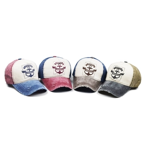 Detailed display of vintage washed cotton baseball caps with distressed brim details