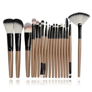 Detailed arrangement of a 20-piece makeup brush set with wooden handles and soft fibers