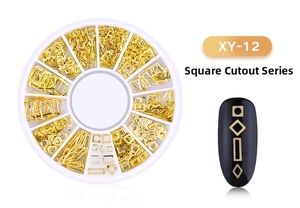 Detailed view of XY-12 gold hollow geometric metal nail art studs in a rotating box