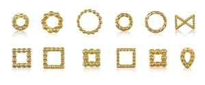 Detailed macro of assorted gold alloy nail charms including moon star and geometric shapes