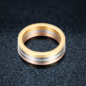 Three-tone 6mm stainless steel band ring set in gold, silver, and rose gold finishes