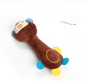 Detail of plush monkey baby rattle toy with soft brown fur and colorful limbs
