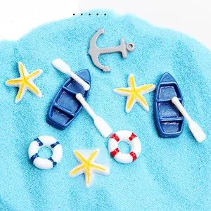 Marine resin charms set featuring blue boat, anchor and lifebuoy for DIY craft projects