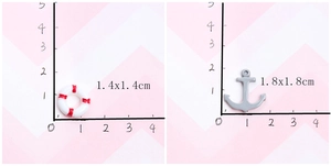 Macro view of 1.4cm lifebuoy and 1.8cm anchor resin charms for DIY ocean phone case crafts