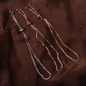 Detailed view of adjustable rhinestone tennis bracelets in gold, silver, and rose gold