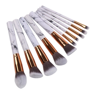 Detail of 10-piece marble makeup brush set with rose gold ferrules and soft gradient bristles